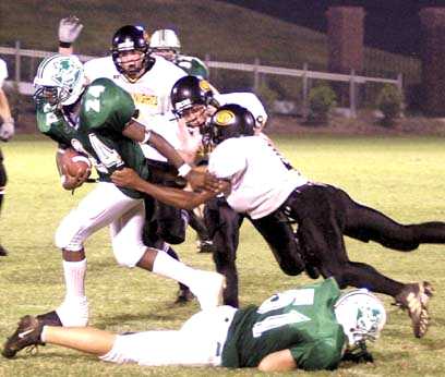 Thomas Lollar struggles for yardage as Chuckey-Doak Adan Blevins hangs on to his shirt.