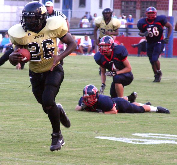 Millington's Travis Simpson takes the ball 85 yards for a touchdown as Panther defender can only watch.